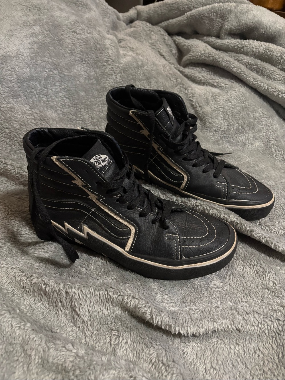 Vans Black High-Top Sneakers with White Lightning Bolt Accent